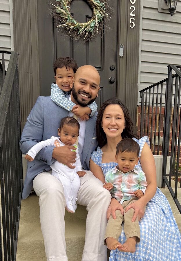 Jeffrey John with his wife and three children